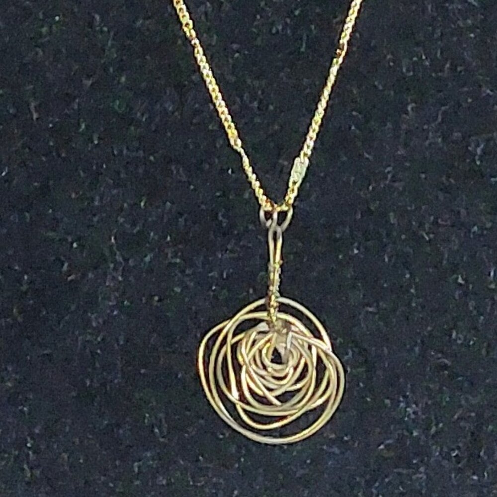 28" Goldtone chain necklace with 1 1/2 " hand wire wrapped rose pendant.
